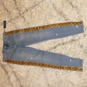 Blank NYC woman's size 28" x 28" The Bond mid-rise skinny holey blue jeans snake